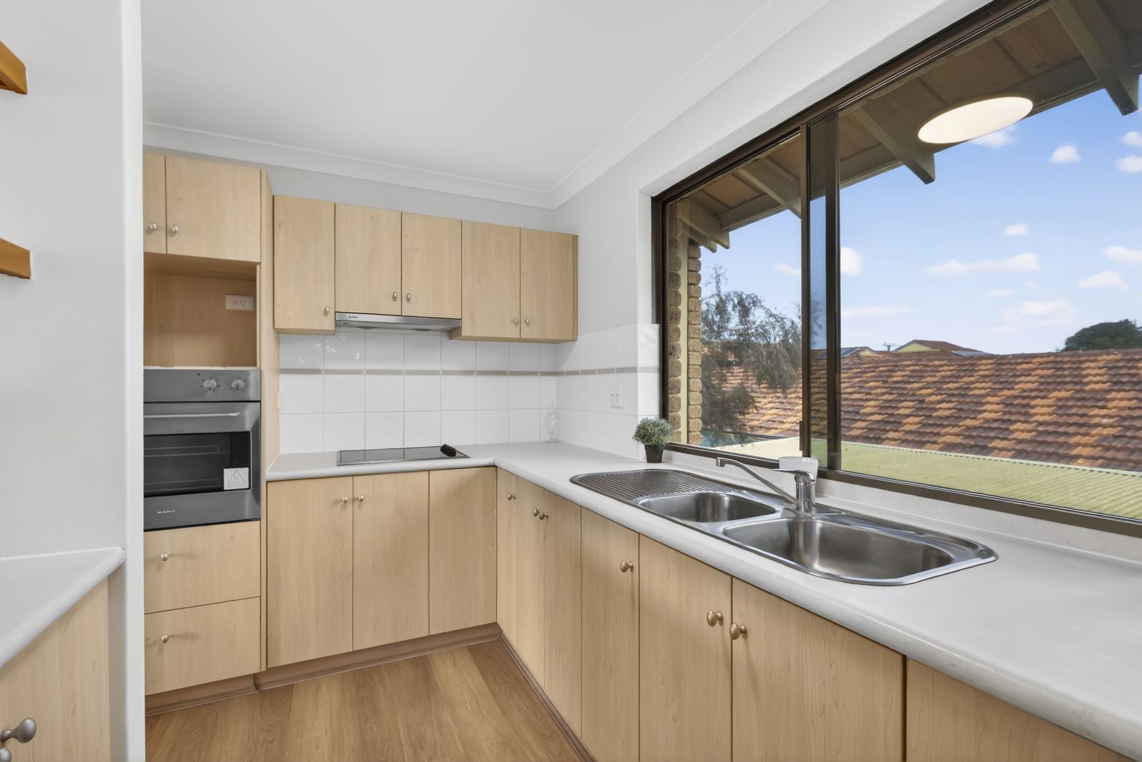 Freshly updated villa with garden views & sunny east-facing balcony