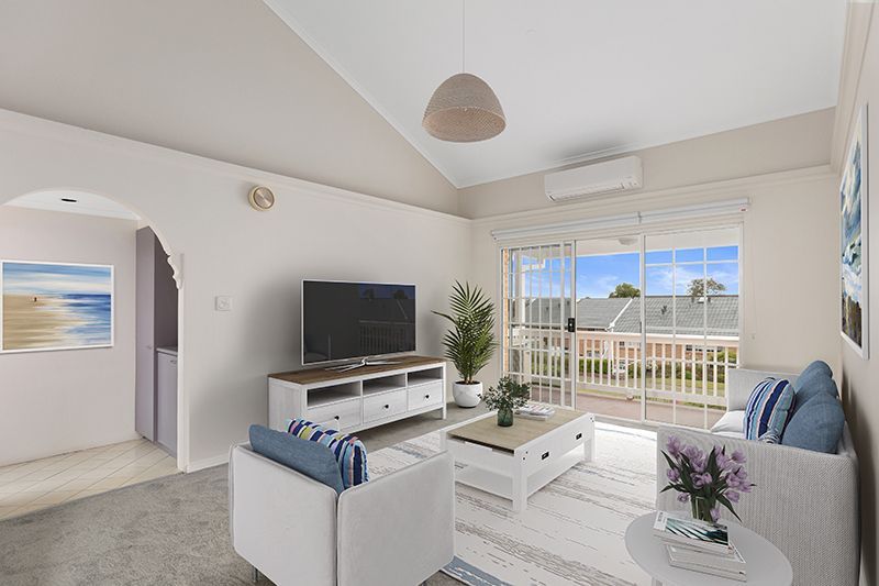 Perfectly located unit overlooking lush, green gardens.