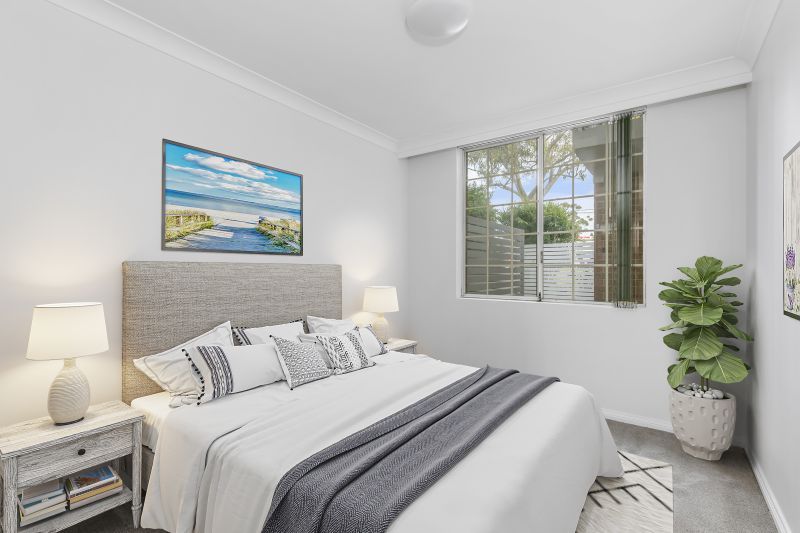 Centrally located, renovated ground floor unit surrounded by lush gardens with large courtyard.