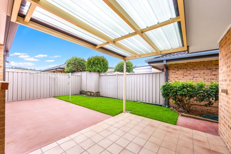 2 bedroom, 1.5 bathroom villa with pet friendly rear yard.