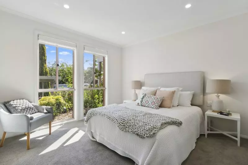 Exclusive three-bedroom villa featuring a pristine backyard