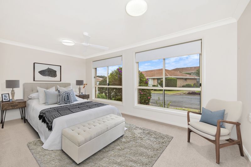 Level villa facing north to catch the winter sun with manicured grounds