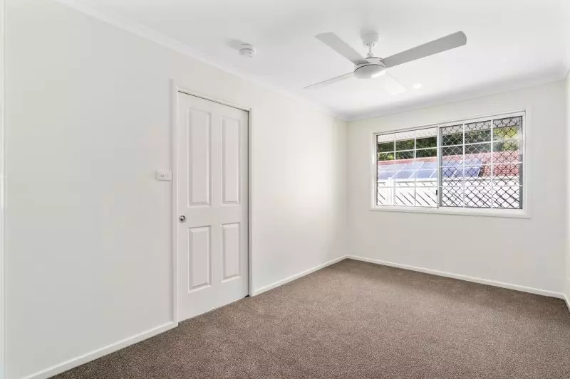 Beautiful two-bedroom, one bathroom villa with enclosed rear entertaining area.