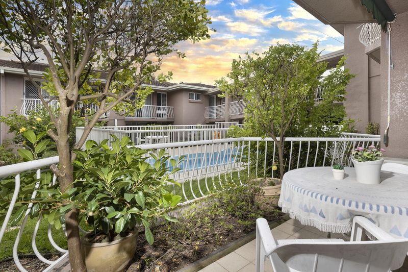 Sunny ground floor serviced apartment with garden and pool views.