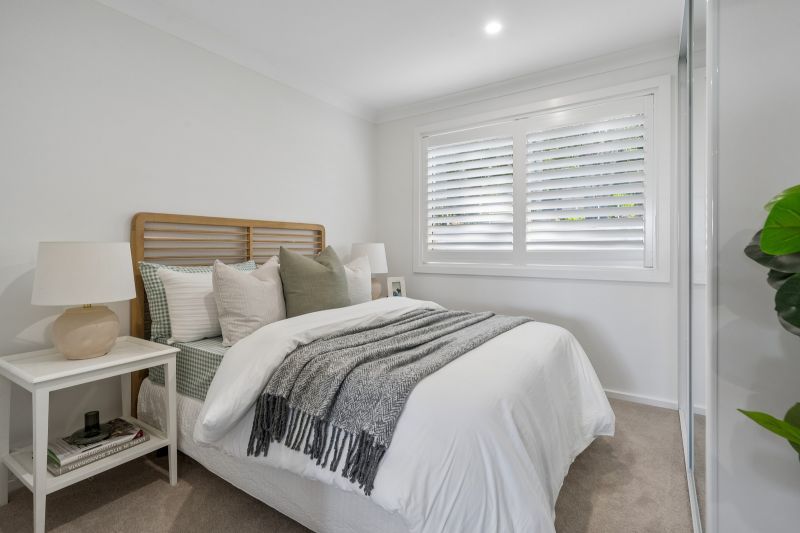 Turn-Key Two-Bedroom Living with Treetop and Water Glimpses