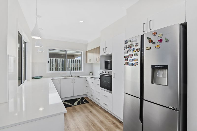 Elevated Home with Spacious Backyard and Modern Interior