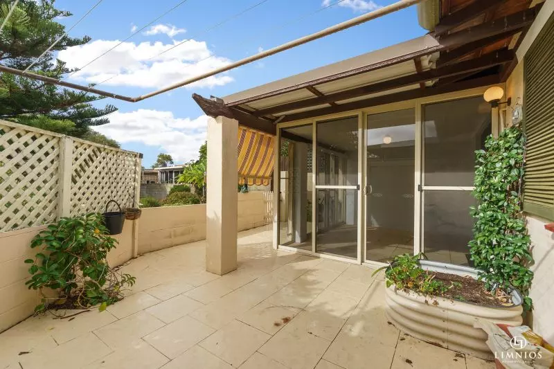SOLD! A bright, light filled unit with a sunroom and leafy outlook
