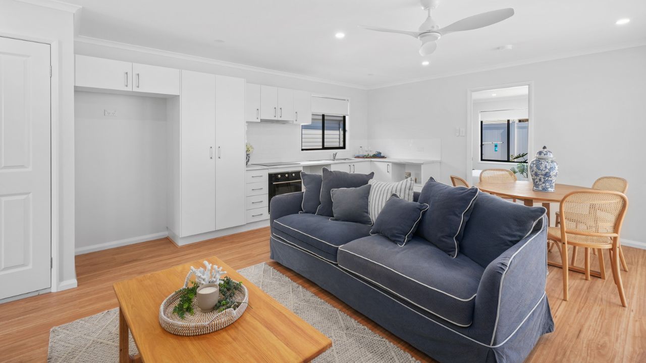 Step into the Pencott, where a charming wrap-around front patio greets you - Lot 176.