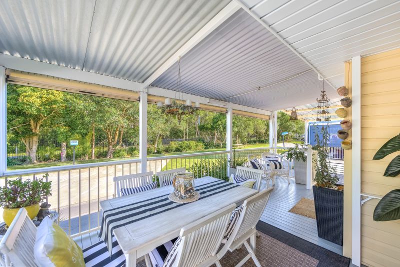 Coastal Gem! Stylish Updates & Serene Green Space