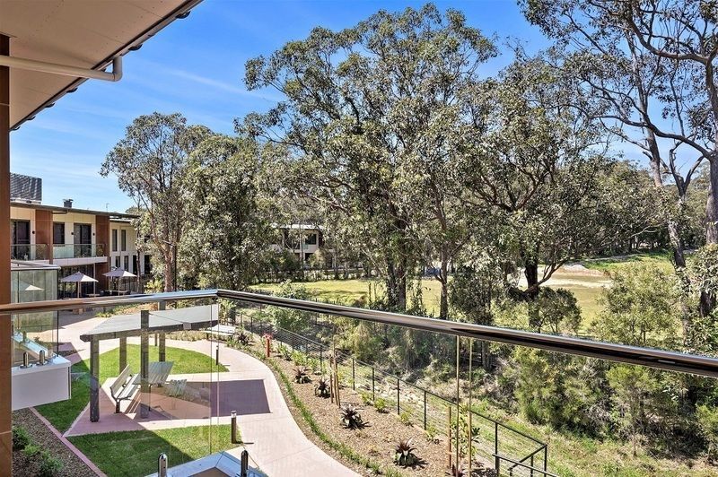 Rare upper level apartment with stunning Northern views over the bowling green.