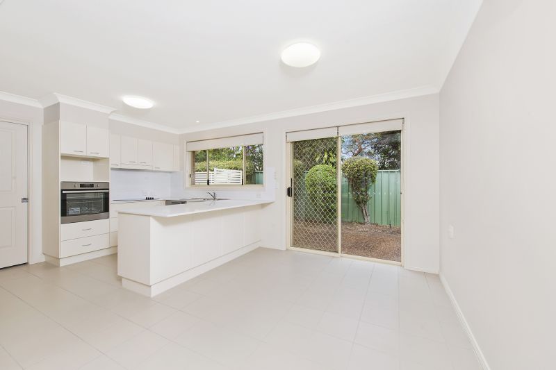Level villa facing north to catch the winter sun with manicured grounds
