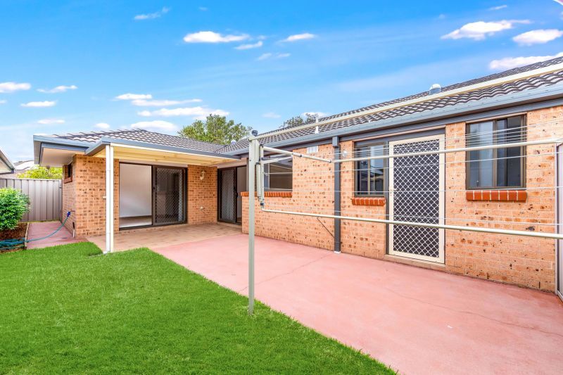 2 bedroom, 1.5 bathroom villa with pet friendly rear yard.