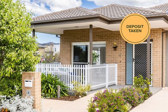 Discover easy living in this beautiful two-bedroom villa at Caddens Village