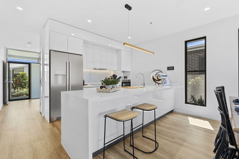 Two-bedroom villa with flexible MPR, designed for relaxed low-maintenance living!