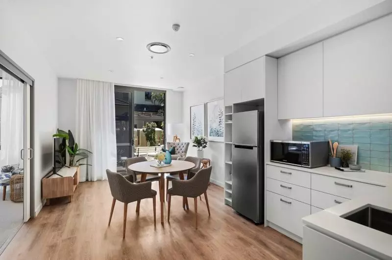 Rare upper level apartment with stunning Northern views over the bowling green.