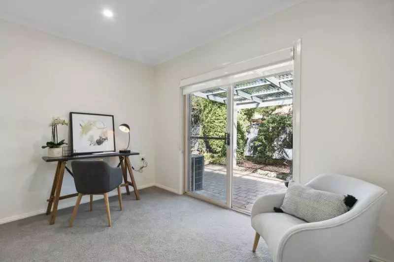 Exclusive three-bedroom villa featuring a pristine backyard